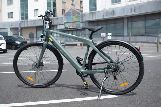 Carbon fiber electric bike with 700c wheels and mid-drive motor, lightweight design